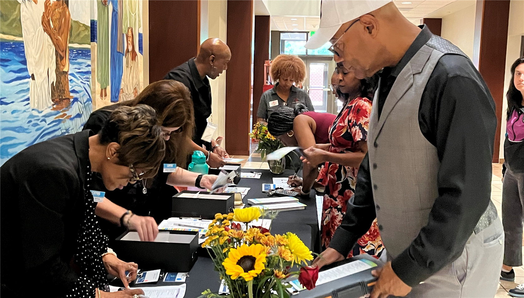  CMS Quarterly Meeting Attendees checking in